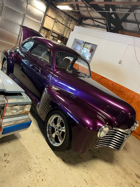 Purple classic car in the shop