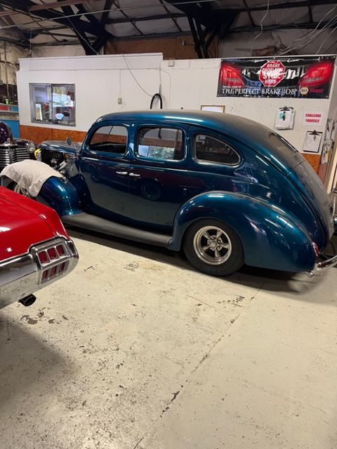Blue classic car in the shop